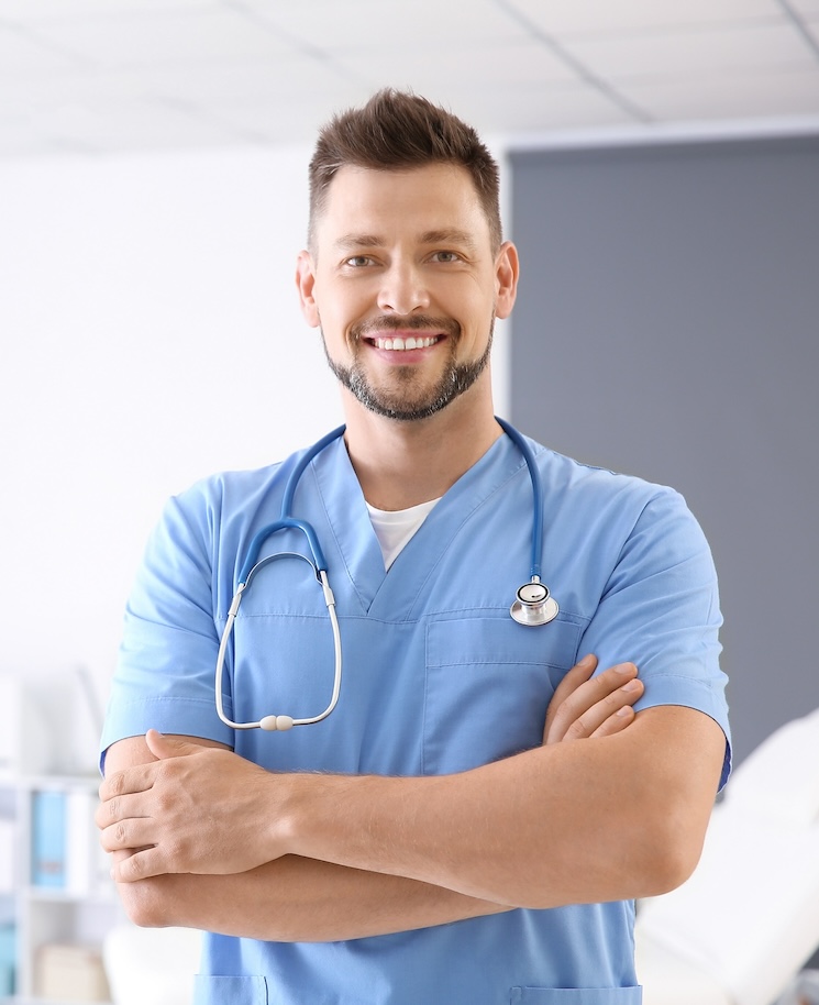 Male nurse with stethoscope in clinic
